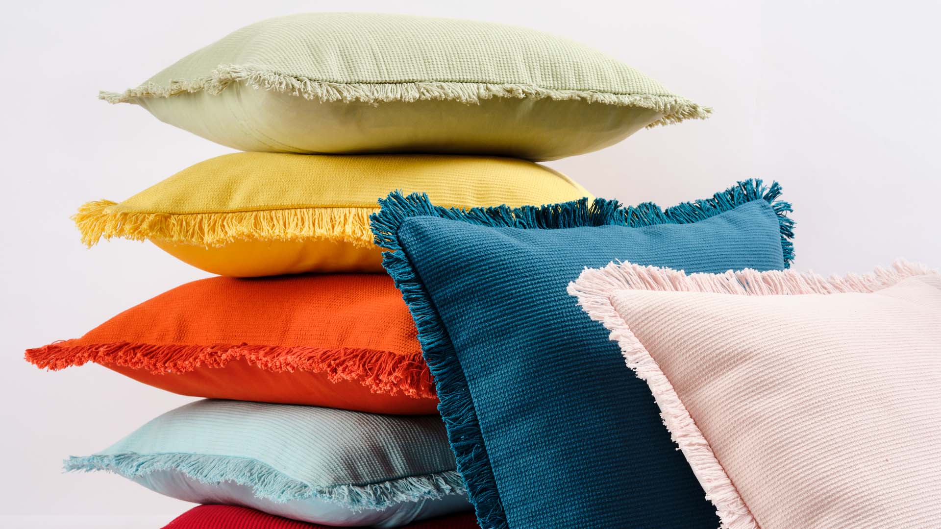 Stack shot of colourful cushions